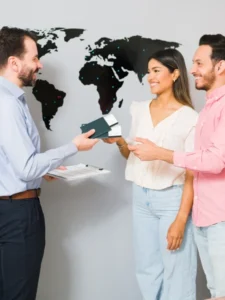 you-are-all-set-your-vacations-sales-representative-giving-passports-plane-tickets-young-woman-man-their-holiday-trip-travel-agency